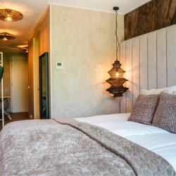 Bed detail van Studio Kamer 28m2 | Hotel Biesbosch